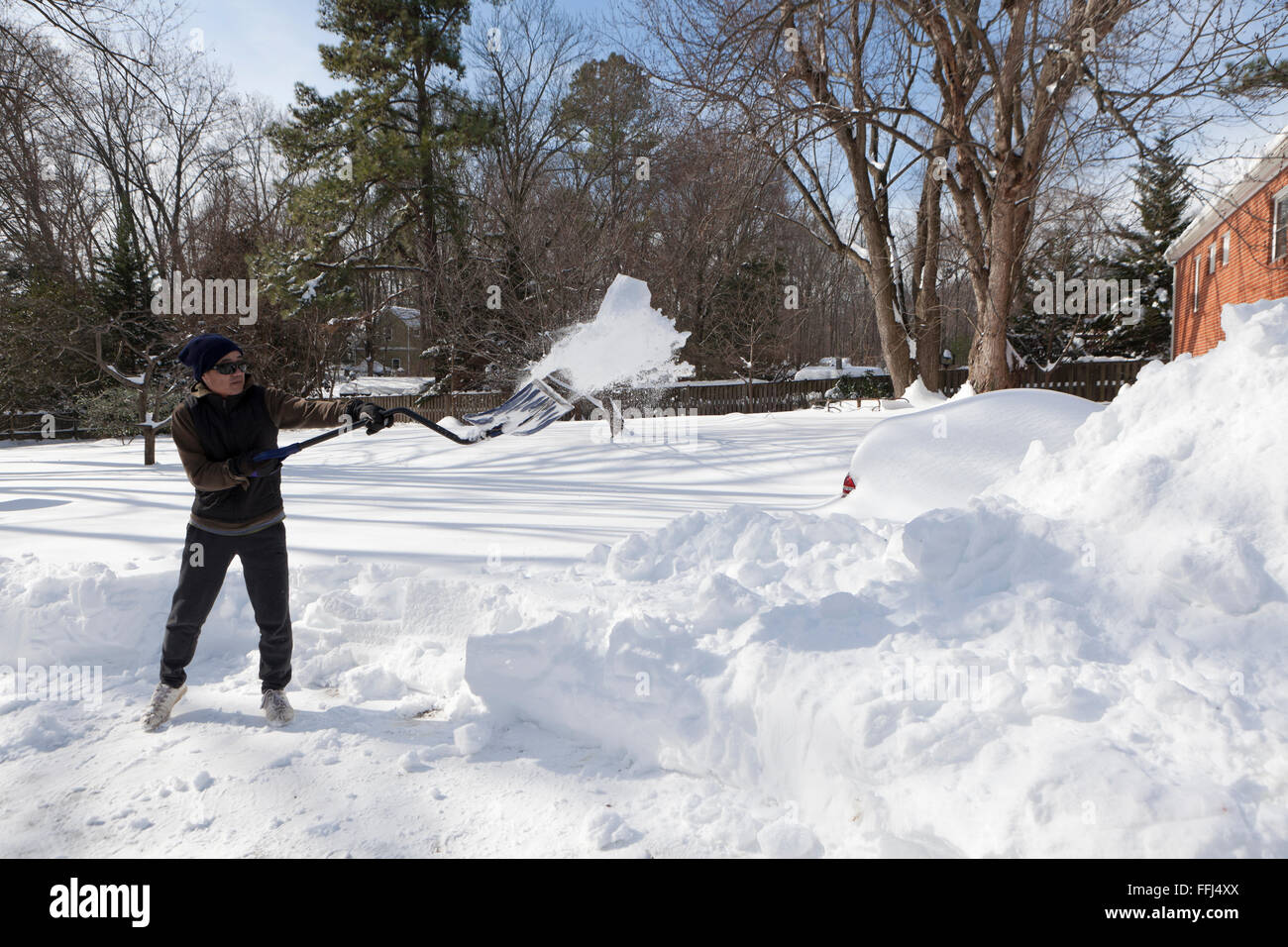 Man shoveling snow from driveway Virginia USA Stock Photo Alamy