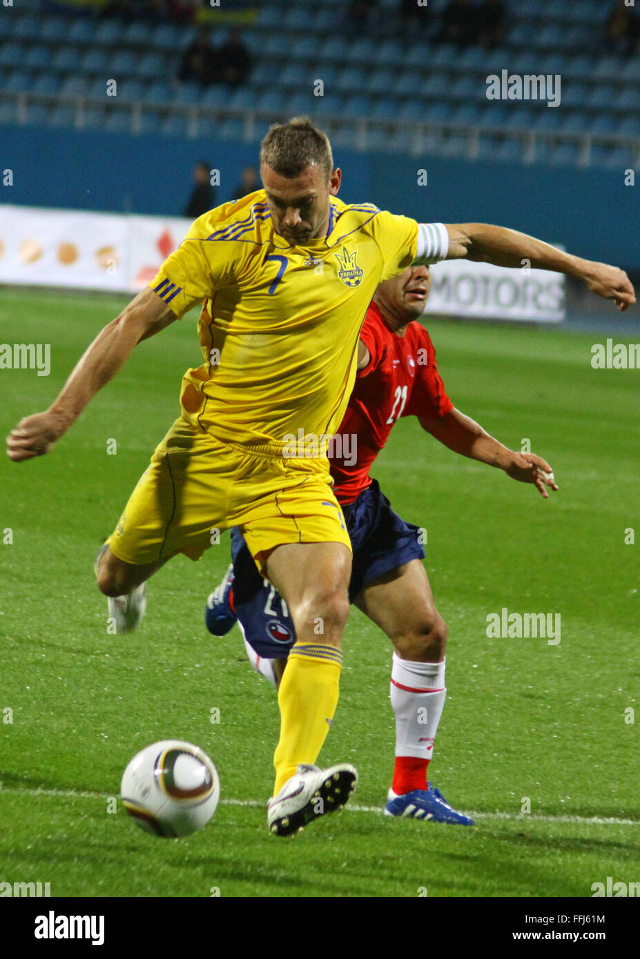 KYIV, UKRAINE - SEPTEMBER 7: Andriy Shevchenko of Ukraine (in yellow) kicks the ball during friendly game against Chile on September 7, 2010 in Kyiv, Ukraine Stock Photo