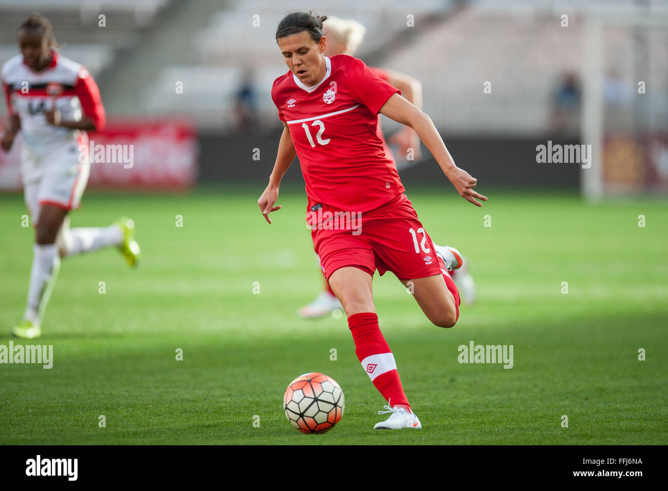 Houston, TX, USA. 14th Feb, 2016. Canada forward Christine Sinclair (12) scores her 159th international goal to pass Mia Hamm and take 2nd place on the all time goal list during a CONCACAF Olympic Qualifying soccer match between Canada and Trinidad & Tobago at BBVA Compass Stadium in Houston, TX. Canada won 6-0.Trask Smith/CSM/Alamy Live News Stock Photo