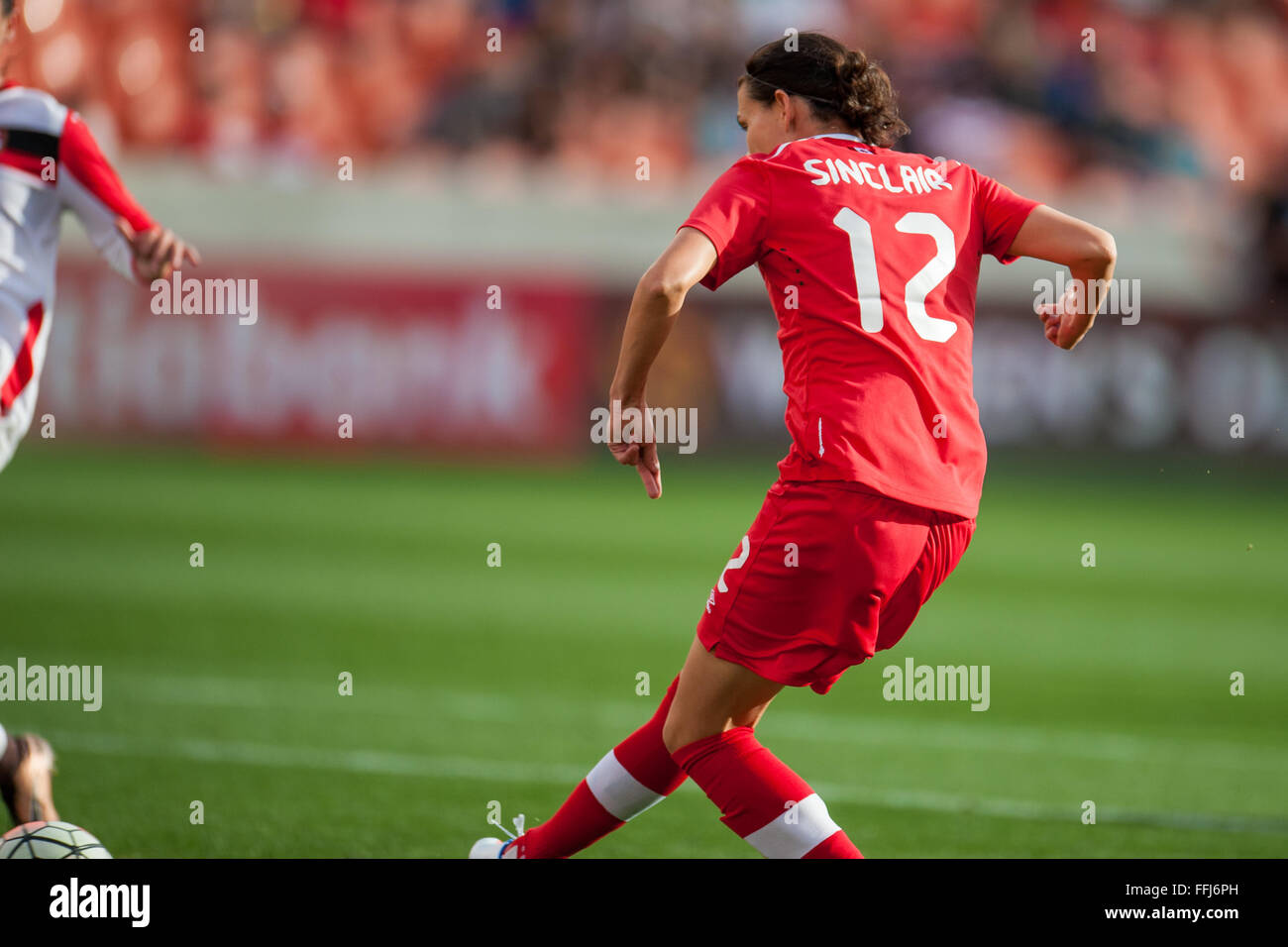 Houston, TX, USA. 14th Feb, 2016. Canada forward Christine Sinclair (12) scores her 159th international goal to pass Mia Hamm and take 2nd place on the all time goal list during a CONCACAF Olympic Qualifying soccer match between Canada and Trinidad & Tobago at BBVA Compass Stadium in Houston, TX. Canada won 6-0.Trask Smith/CSM/Alamy Live News Stock Photo