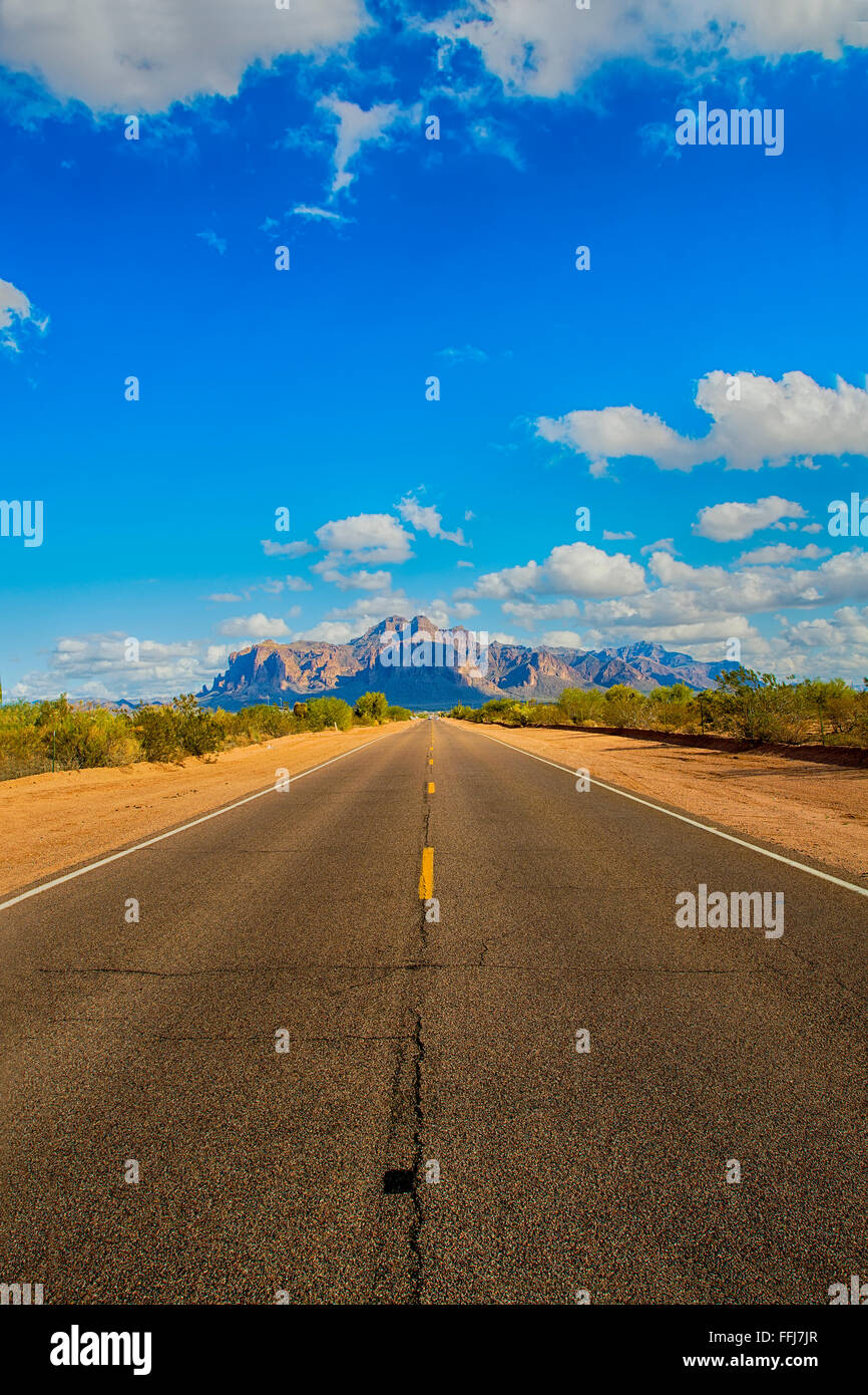 A long remote road leading to the base of famous Superstition Mountain in Arizona shows the beauty of this desert landscape. Stock Photo