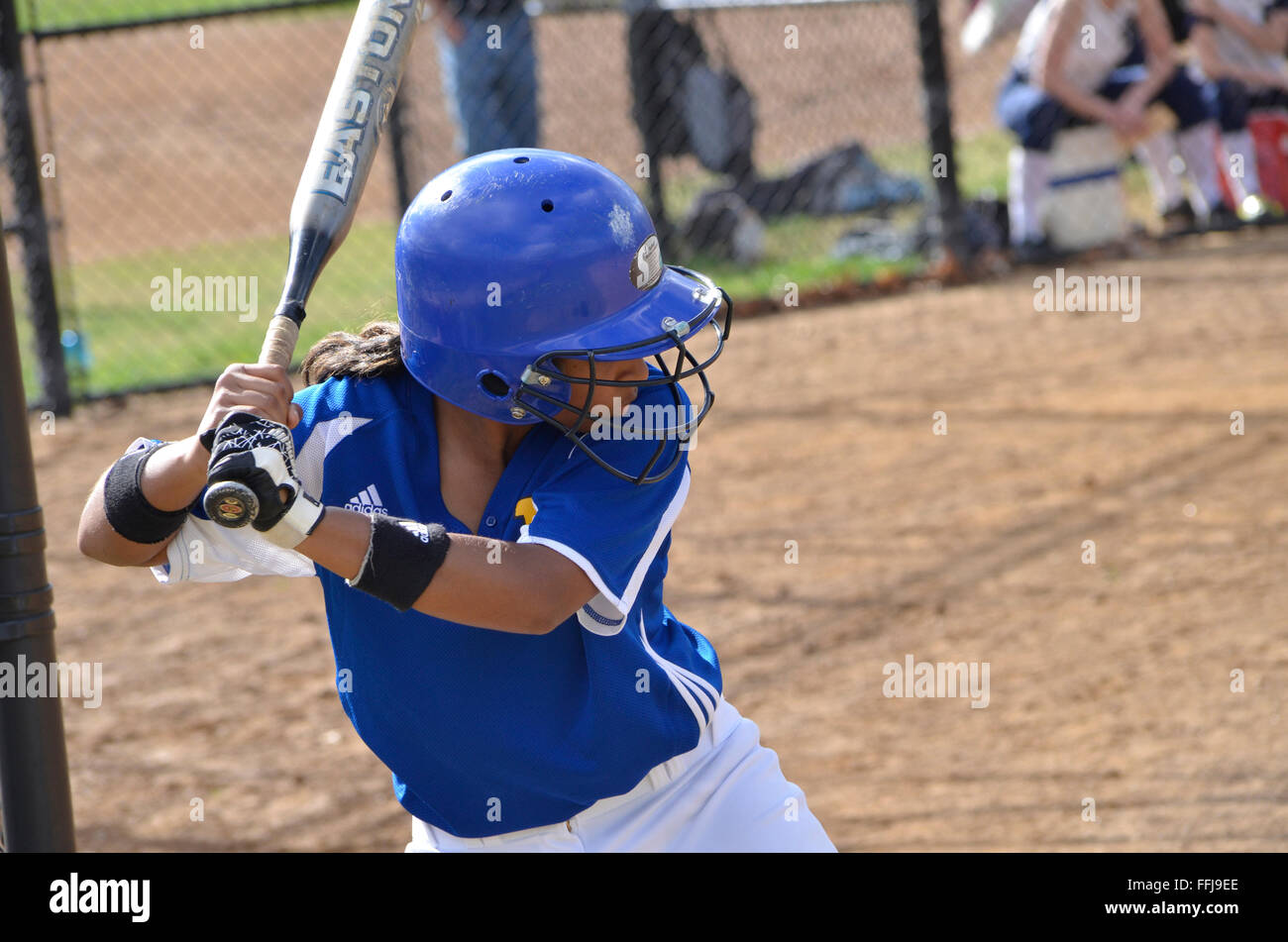 Batter in a high school girl's  softball game Stock Photo