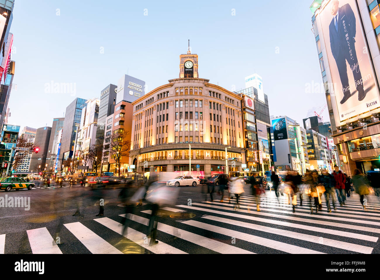 Tokyo, Japan - Jan 18, 2015:  Ginza shopping district at rush hour in Tokyo. The iconic Ginza Wako building is at the background Stock Photo