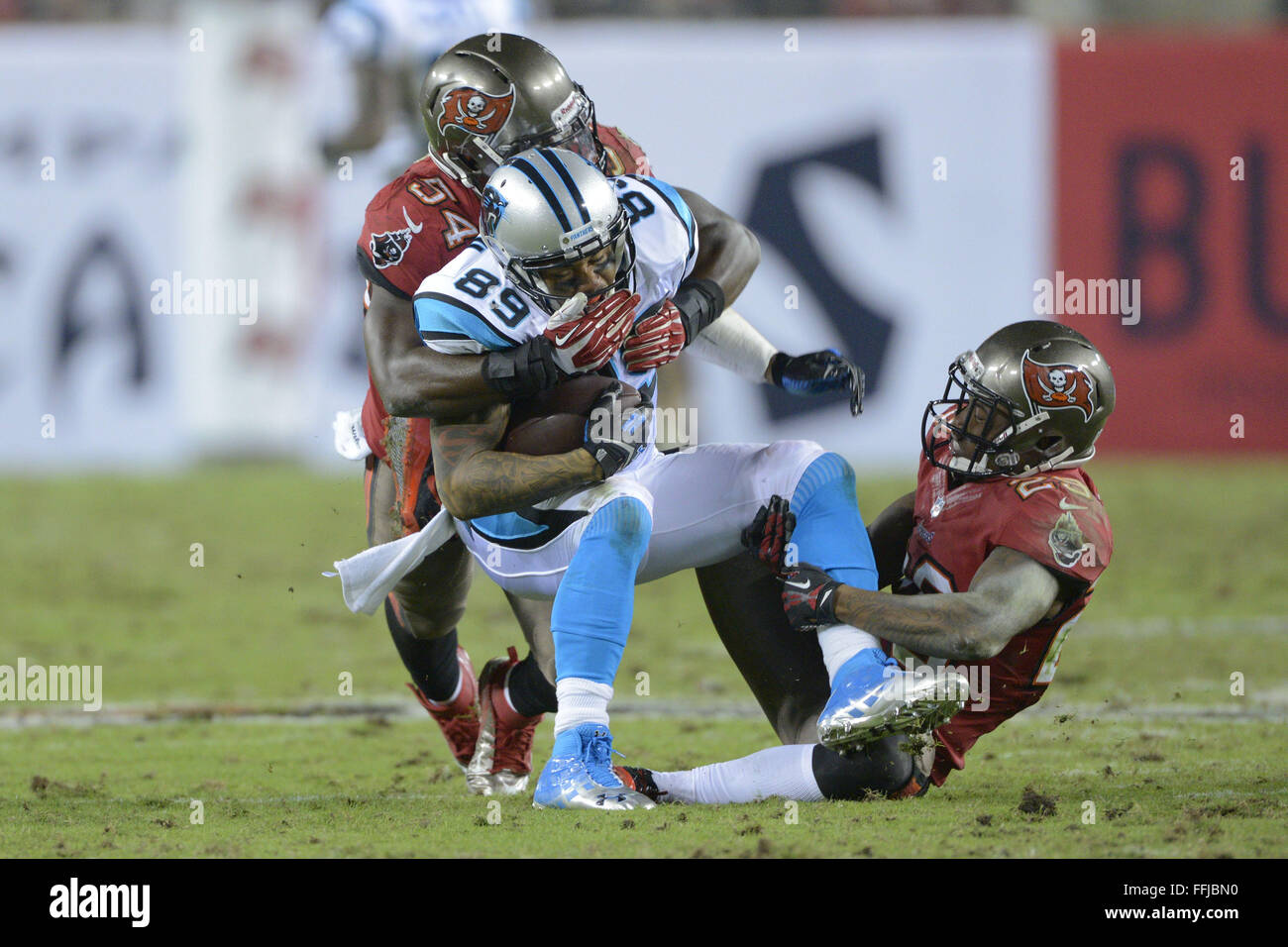 Tampa, FL, USA. 24th Oct, 2013. Carolina Panthers wide receiver Steve Smith (89) is tackled by Tampa Bay Buccaneers outside linebacker Lavonte David (54) and cornerback Leonard Johnson (29) during the Panthers 21-6 win over the Buccaneers at Raymond James Stadium on October 24, 2013 in Tampa, Florida. ZUMA PRESS/Scott A. Miller © Scott A. Miller/ZUMA Wire/Alamy Live News Stock Photo