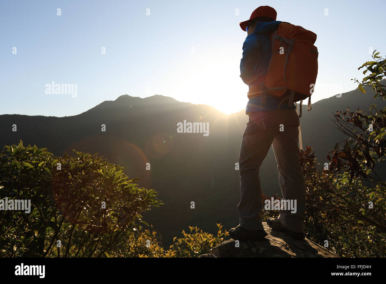 successful woman hiker on sunrise mountain peak Stock Photo - Alamy