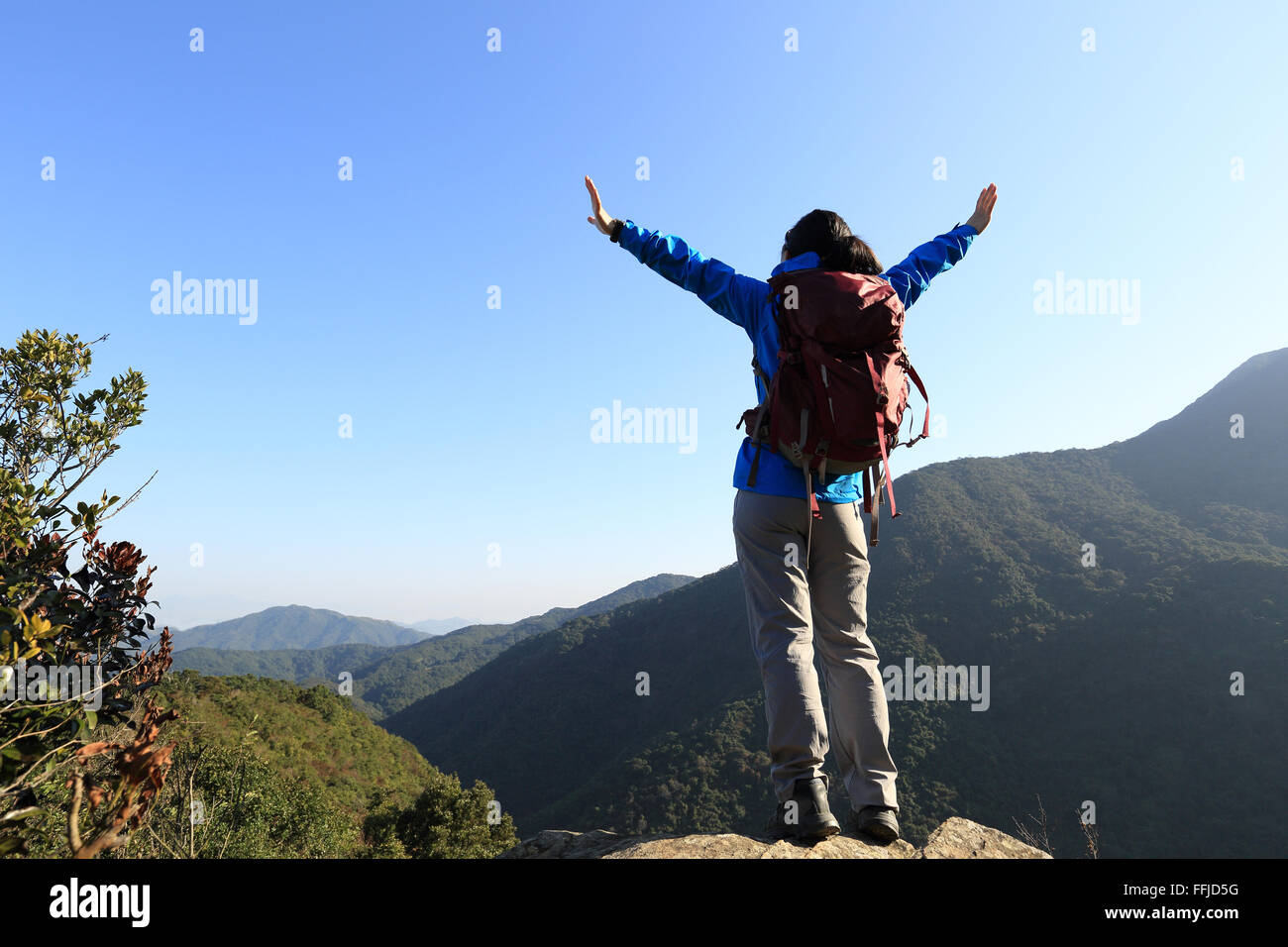 successful woman hiker open arms on sunrise mountain peak Stock Photo ...