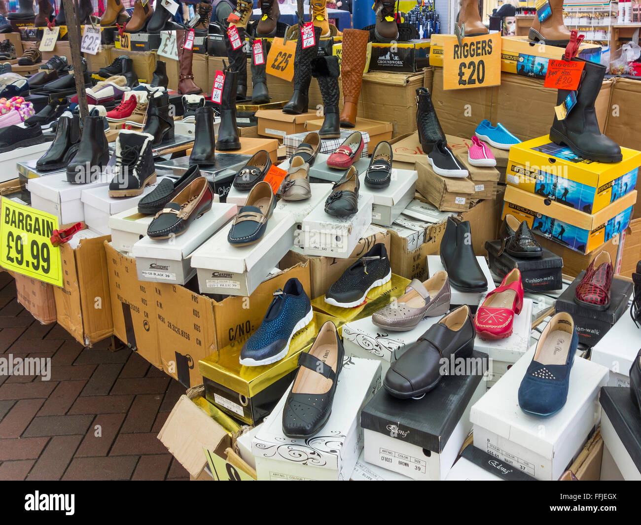 Display cheap footwear Work Boots and shoes at the Weekly Market in Redcar  Cleveland North Yorkshire UK Stock Photo - Alamy