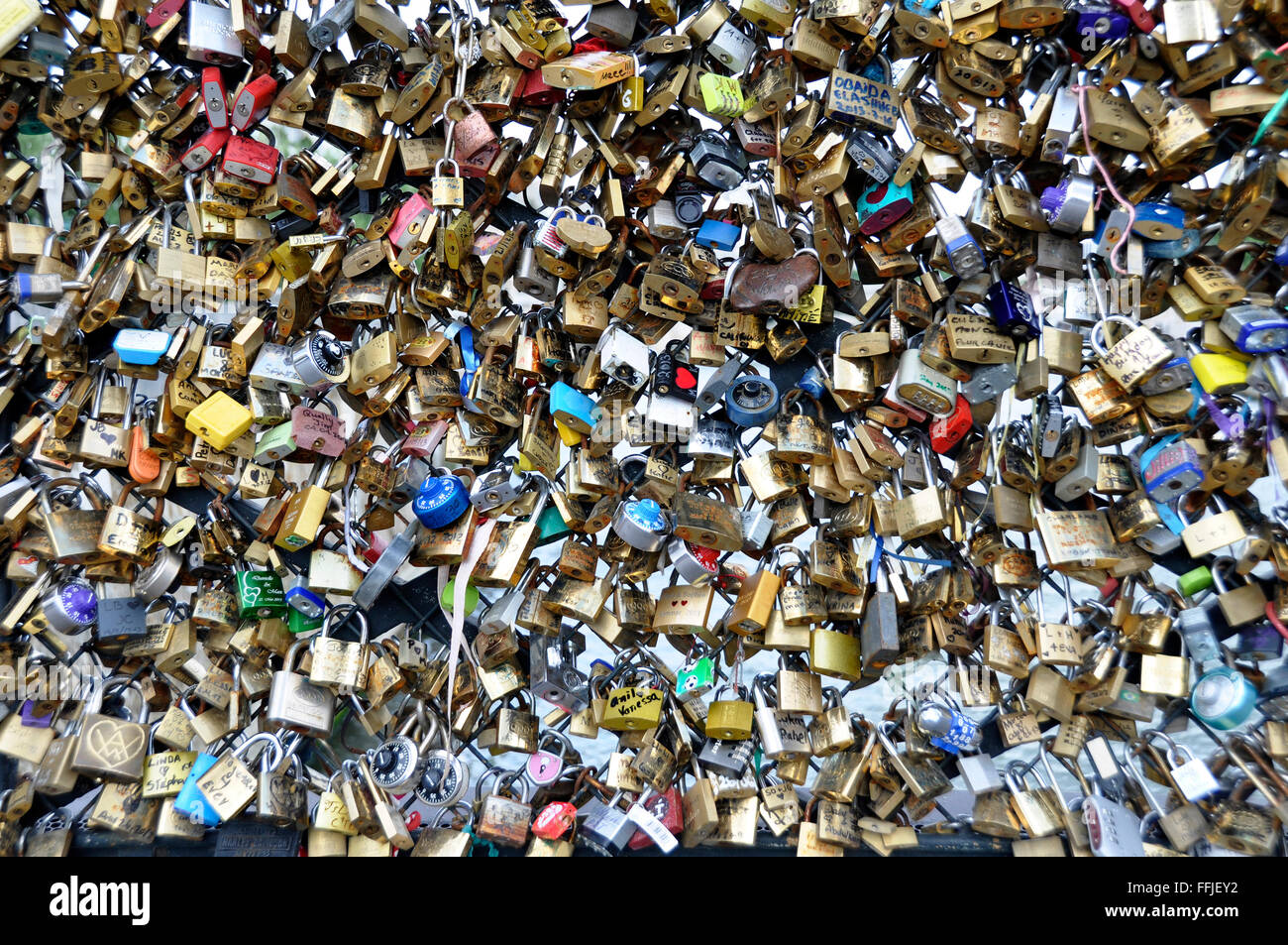 PARIS - August 20: Love Padlocks at Pont des Arts on Agust 20, 2013, in Paris. The thousands of locks of loving couples symboliz Stock Photo