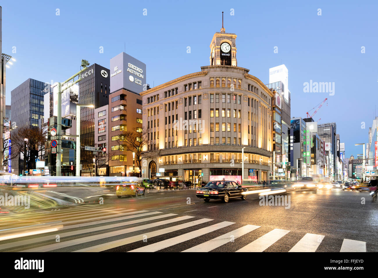 Tokyo, Japan - January 18, 2015:  Ginza shopping district at rush hour in Tokyo, with the iconic Ginza Wako building. Stock Photo