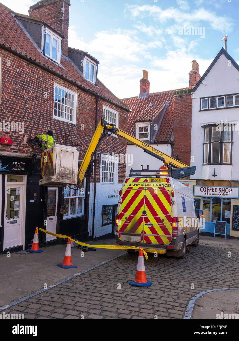 North Yorkshire Highways technician using a van mounted hydraulic hoist