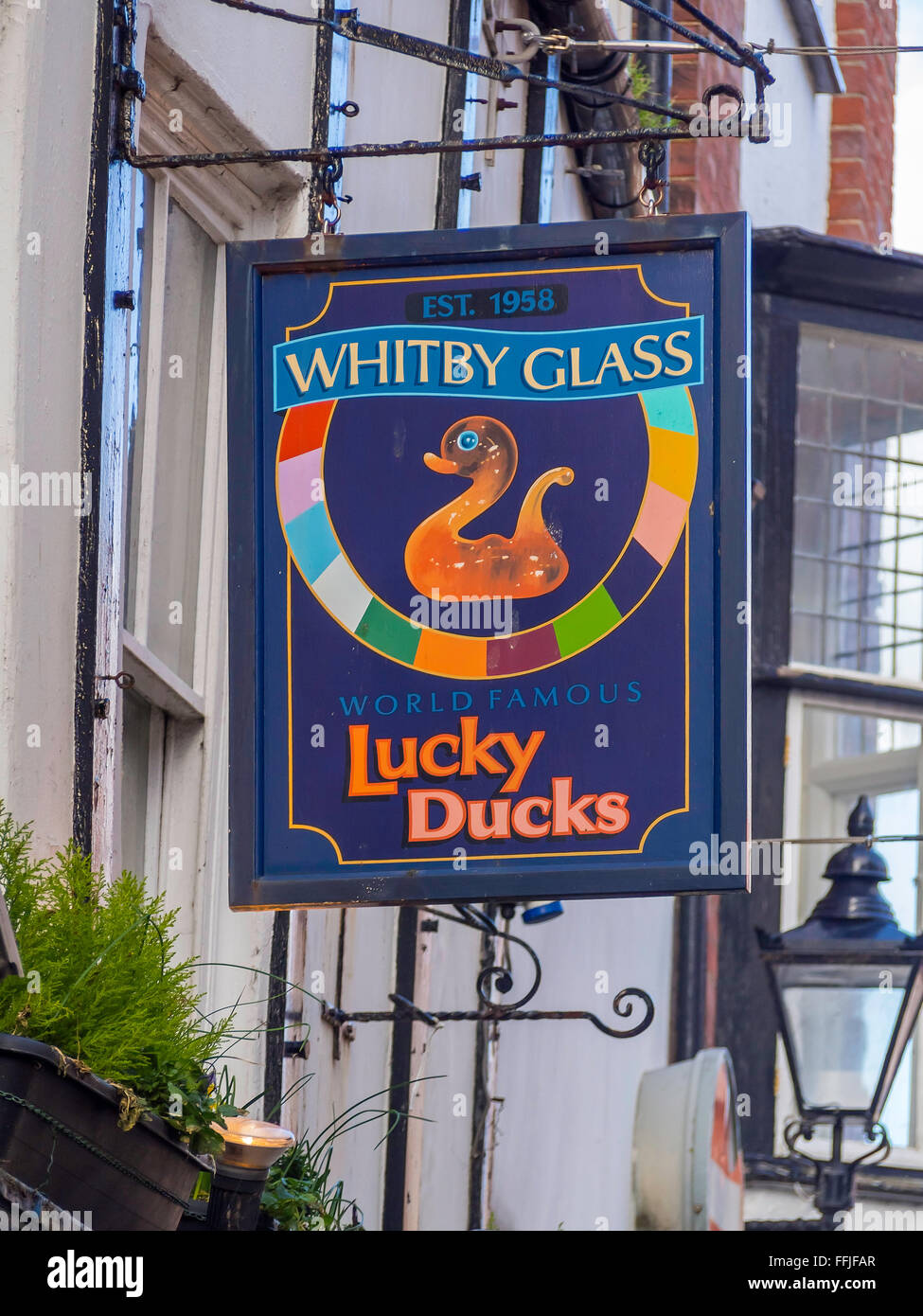 Shop sign of Whitby Glass World Famous Lucky Duck manufacturer and retailer of glass ornaments Whitby North Yorkshire Stock Photo