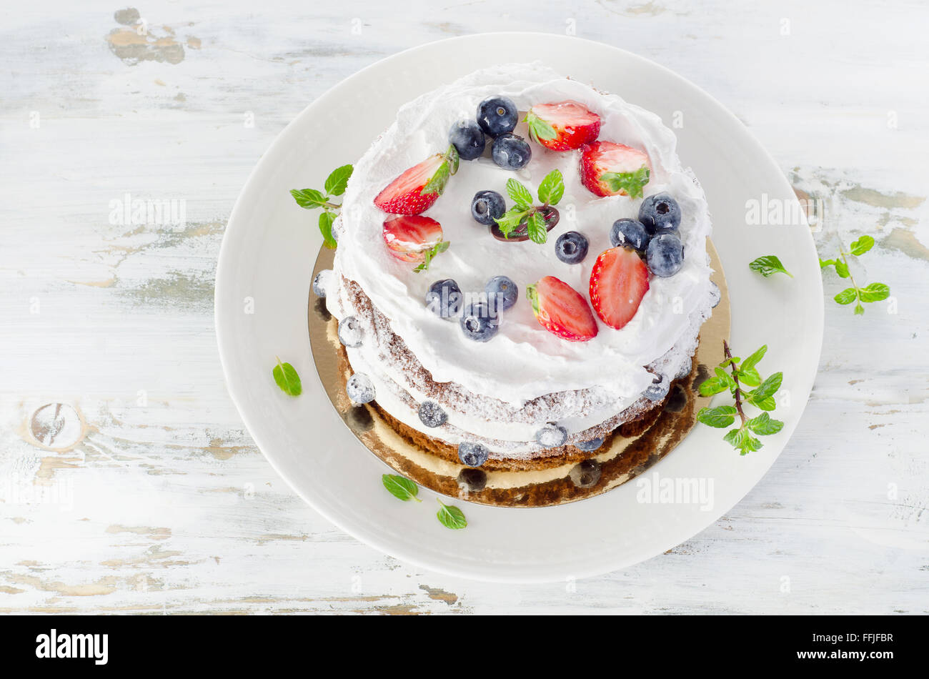 Cake with cream and strawberries. View from above Stock Photo