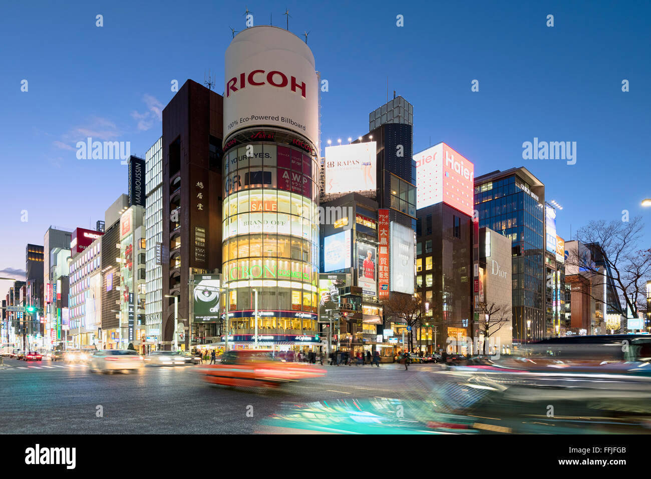 Tokyo, Japan - January 18, 2015:  Ginza shopping district at rush hour in Tokyo with iconic  Sanaa Building . Stock Photo