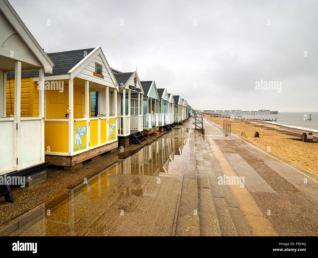 Suffolk Southwold beach huts pier and the North Sea near the mouth of