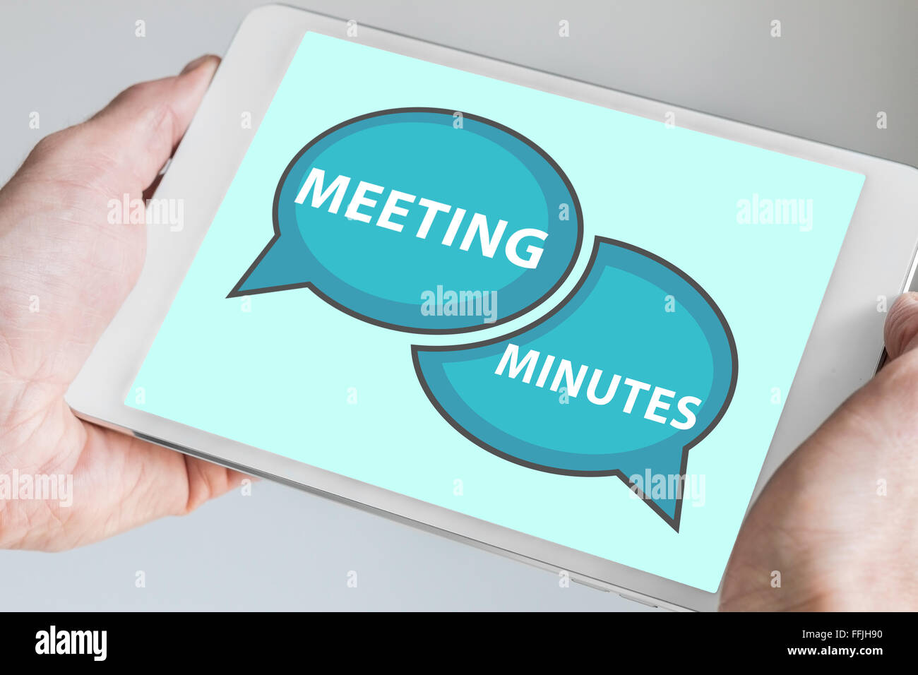 Meeting minutes concept with hands holding modern tablet or smartphone