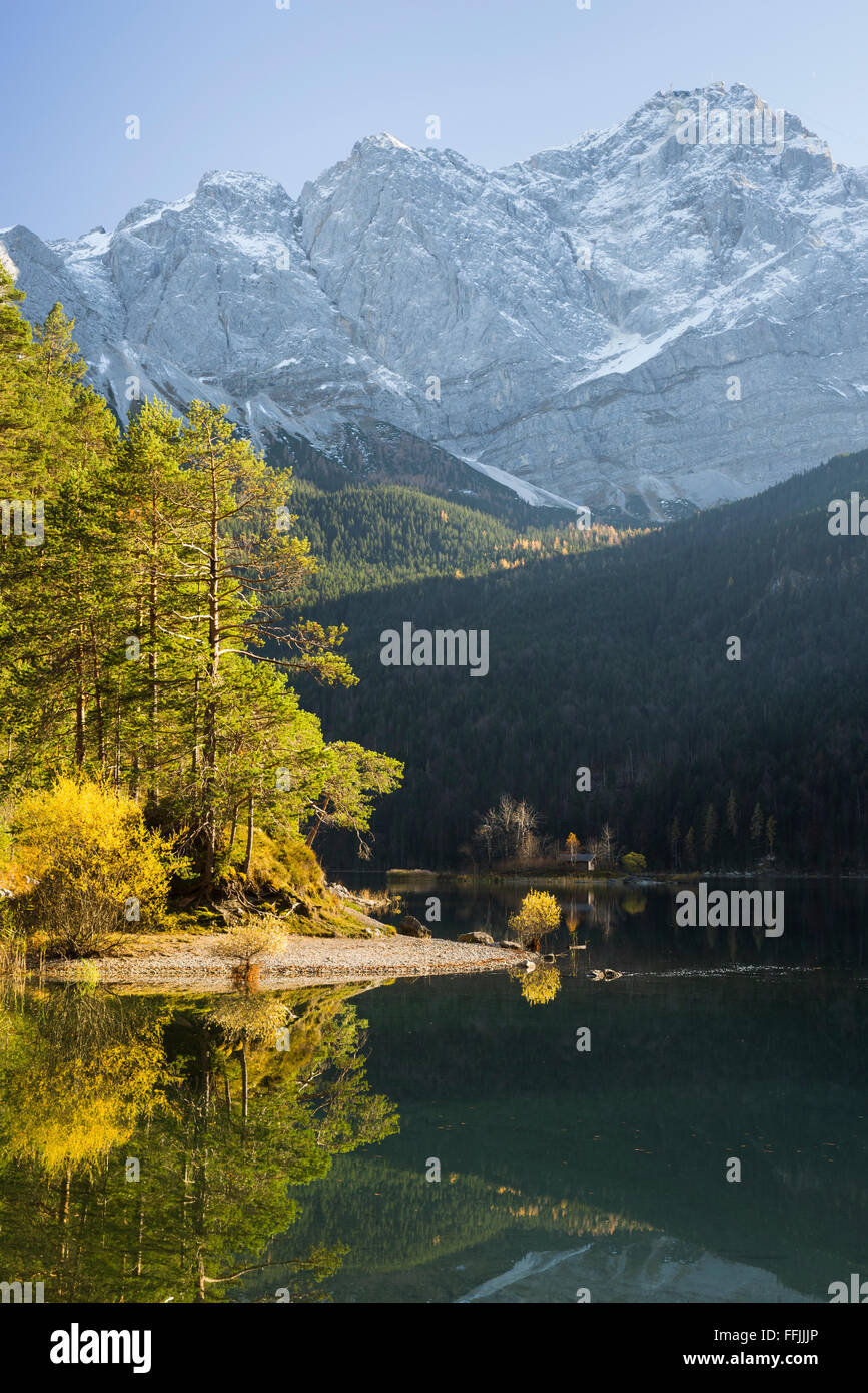 Lake Eibsee in autumn with autumn trees and the snow covered Mount Zugspitze near Garmisch-Partenkirchen, Bavaria, Germany Stock Photo