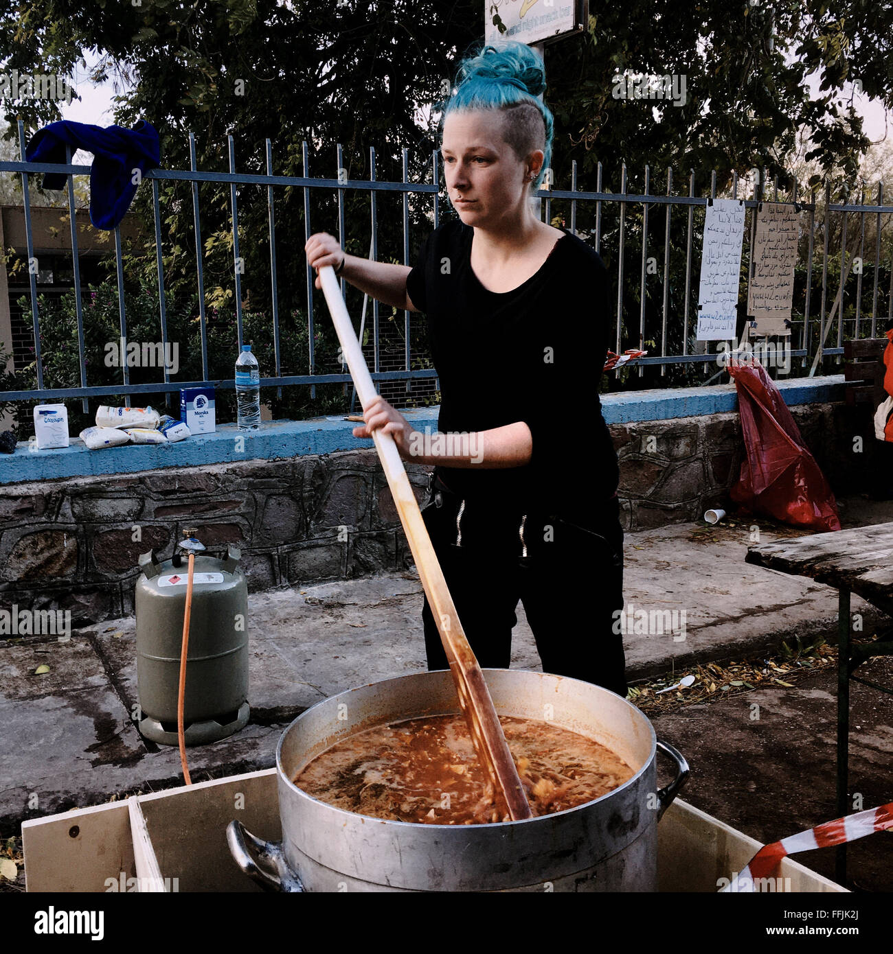 Woman from Germany came to cook to the refugees in the No Border Kitchen. The no border kitchen is a citizen initiative Stock Photo