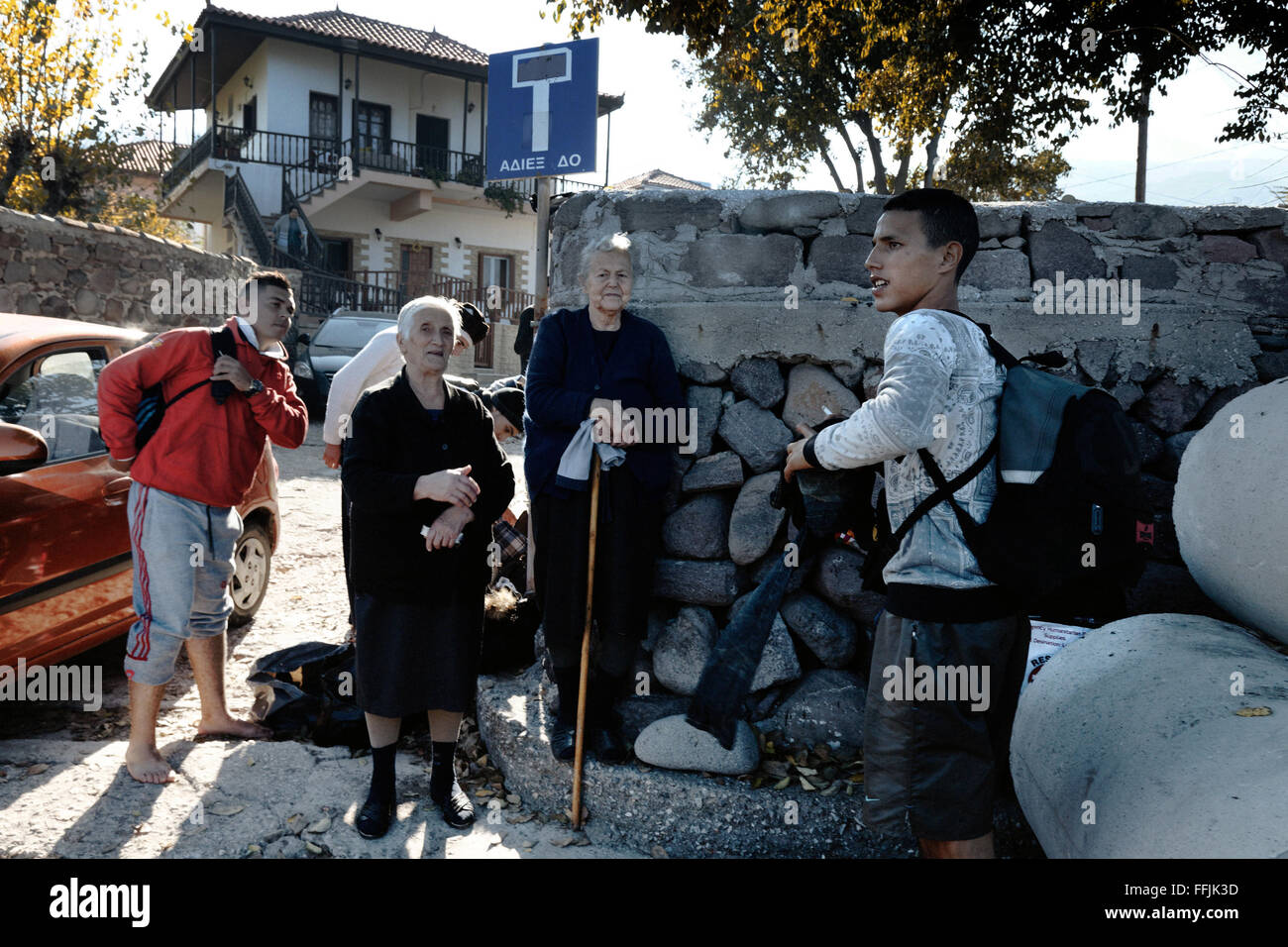 Elderly women of Scala Sycamnias come and watch refugees arriving. This group of women has somehow become famous Stock Photo