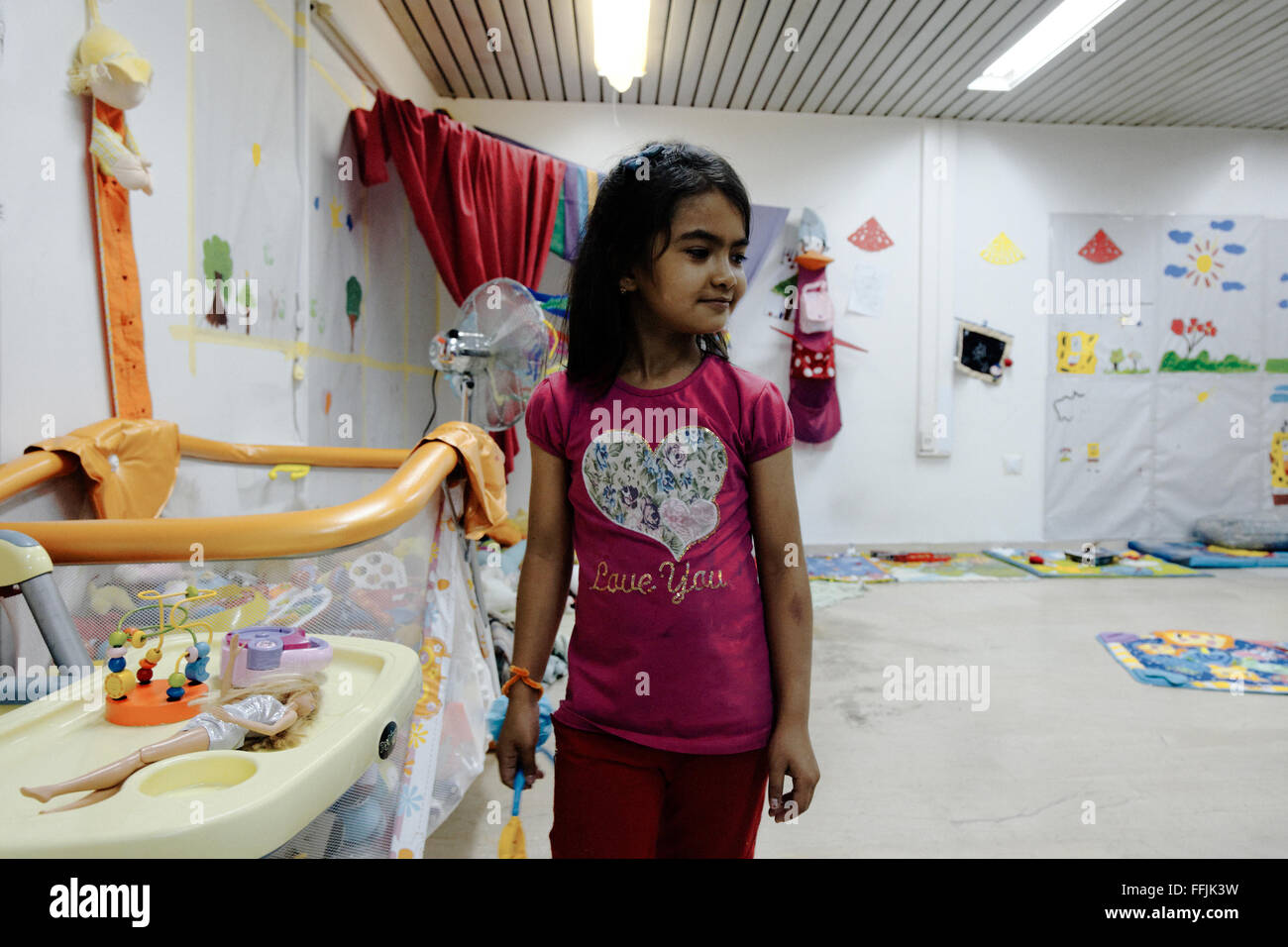 Children play in Notara's playground room. Notara 26 is a housing-transit squat for refugees families mainly, passing in Athens, Stock Photo