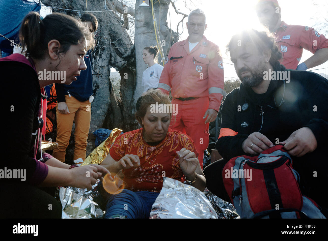 Doctors help refugees after having crossed the 7 miles of distance from Turkish coast to Lesvos. Stock Photo