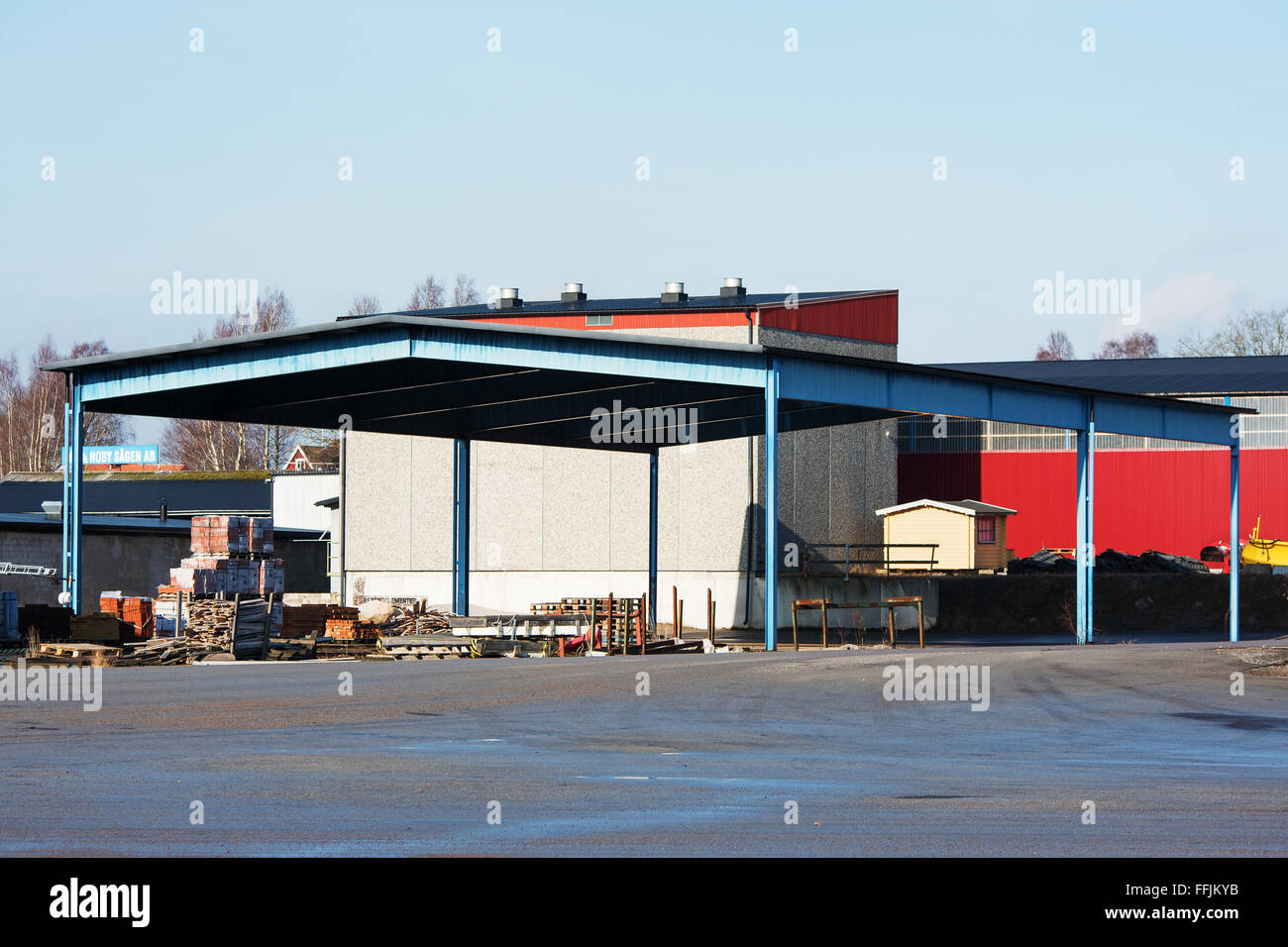 Brakne-Hoby, Sweden - February 07, 2016: An outdoor storage area under a steel roof in an industrial area. Industrial building i Stock Photo