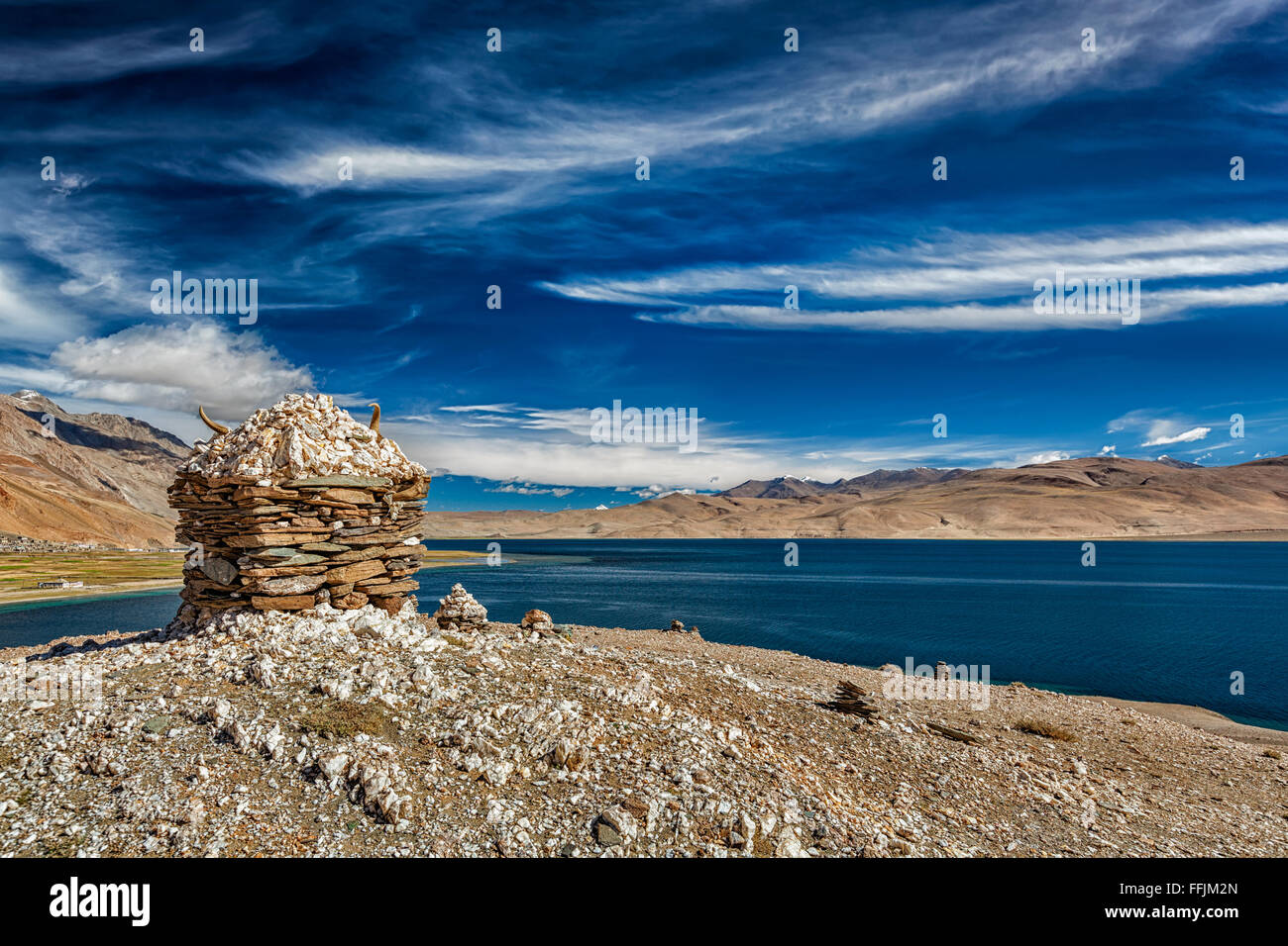Stone cairn at Himalayan lake Tso Moriri, Stock Photo