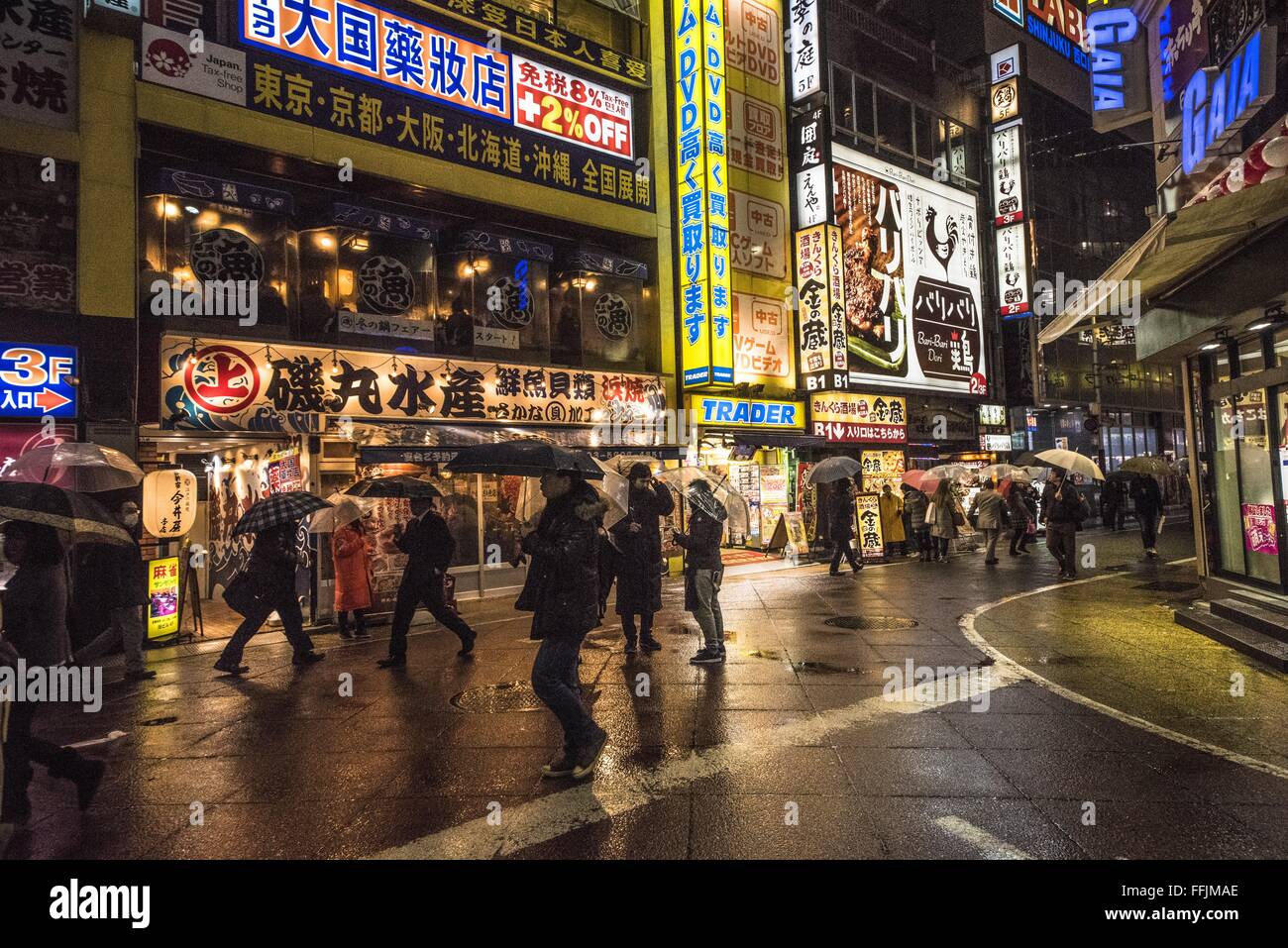 TOKYO, JAPAN - January 29, 2016: Street scene in Shinjuku in rain Stock Photo