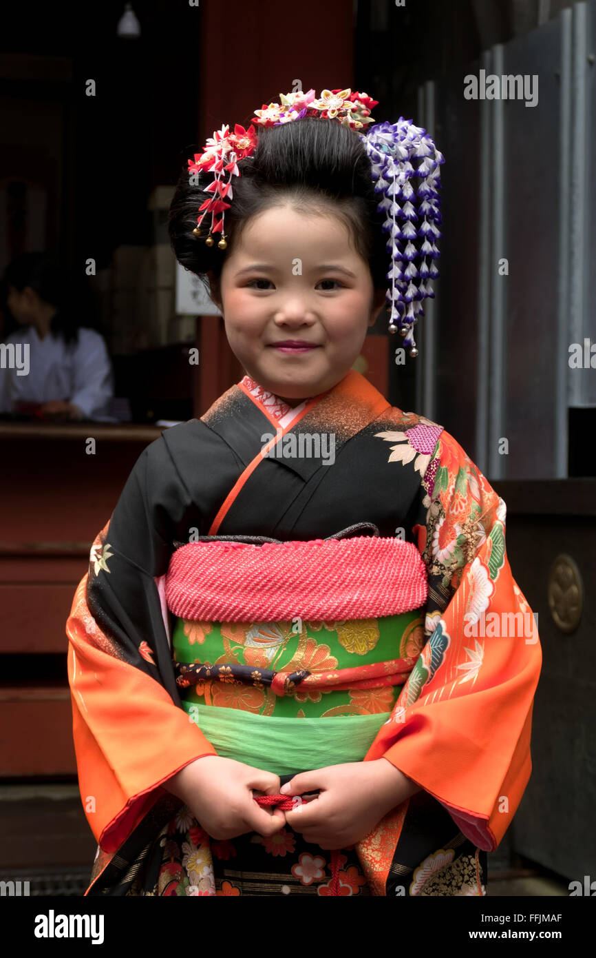 Japanese little girl, happy female child, geisha posing for a photo. Nikko, Japan, Asia. Traditional make-up and dress Stock Photo
