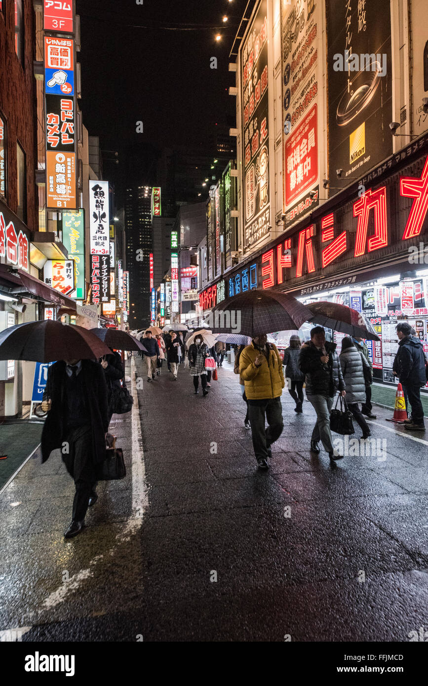TOKYO, JAPAN - January 29, 2016: Street scene in Shinjuku in rain Stock Photo