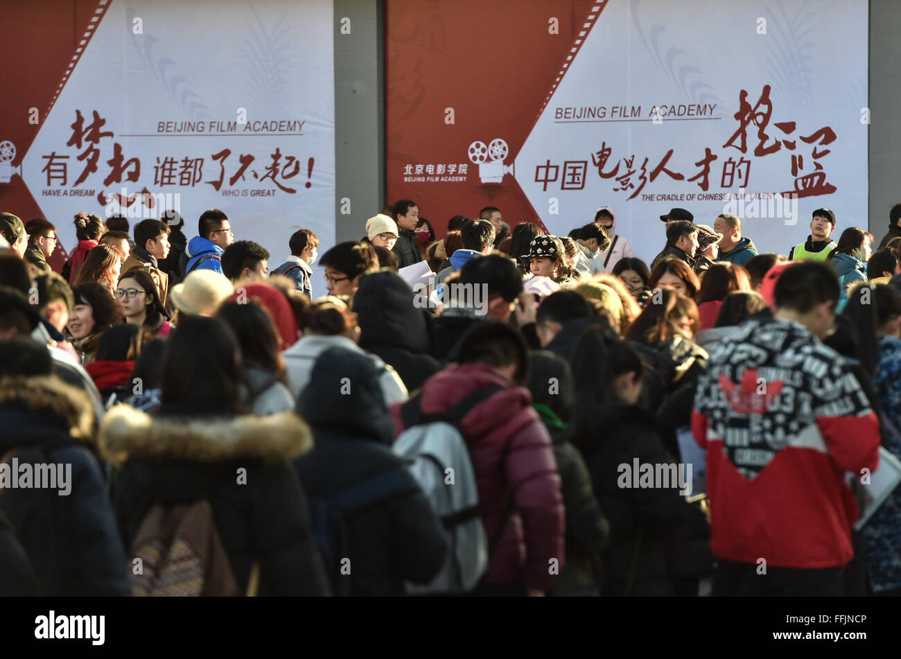 Beijing, China. 15th Feb, 2016. Candidates wait outside the examination hall at Beijing Film Academy (BFA) in Beijing, capital of China, Feb. 15, 2016. The annual entrance exam of China's art colleges including BFA, the Central Academy of Drama and the Communication University of China started simultaneously on Monday. Over 7,600 applicants for BFA's performance institute will take part in the exam to vie for 45 vacancies in the institute. Some Chinese young people regarded studying in an art college as a shortcut to become famous in recent years. © Luo Xiaoguang/Xinhua/Alamy Live News Stock Photo