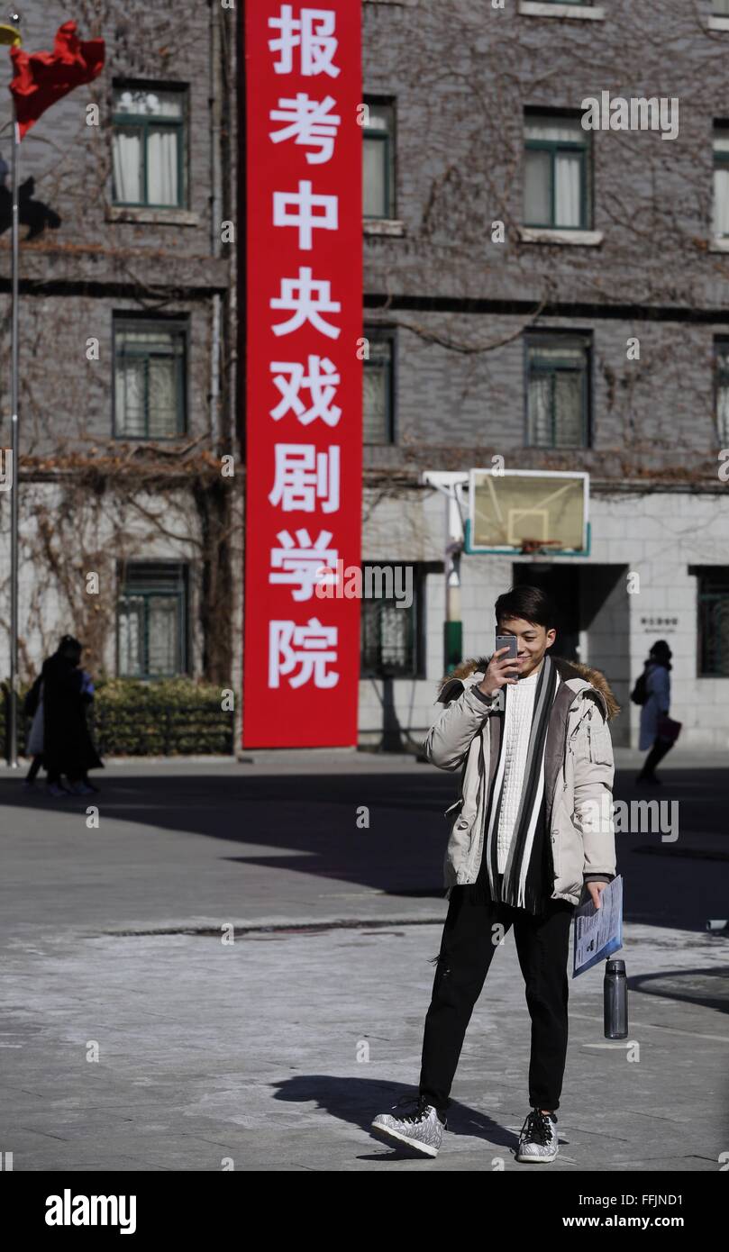 Beijing, China. 15th Feb, 2016. A candidate takes a selfie at the Central Academy of Drama in Beijing, capital of China, Feb. 15, 2016. The annual entrance exam of China's art colleges including Beijing Film Academy, the Central Academy of Drama and the Communication University of China started simultaneously on Monday. Some Chinese young people regarded studying in an art college as a shortcut to become famous in recent years. © Shen Bohan/Xinhua/Alamy Live News Stock Photo
