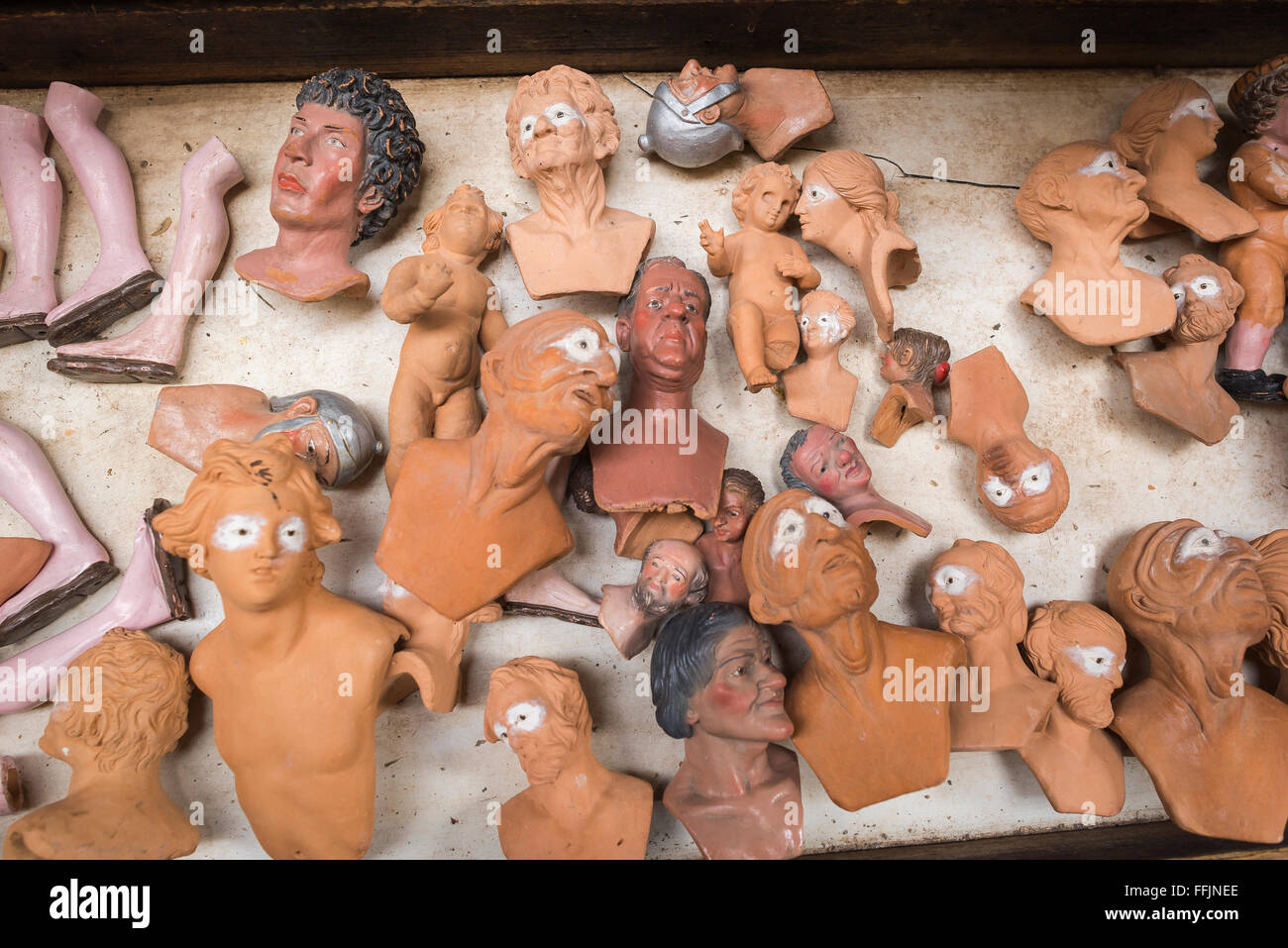 Naples crib shop, a batch of clay heads crafted by artisans in a crib shop in the Via San Gregorio Armeno, Naples, Campania, Italy. Stock Photo