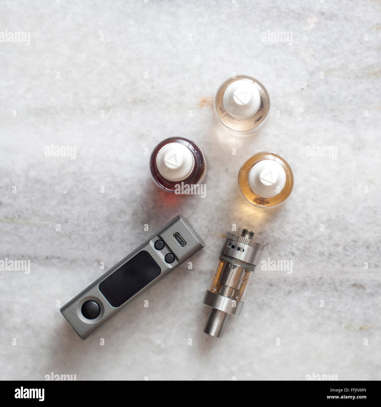 e-cigarettes with lots of different re-fill bottles, from above Stock Photo