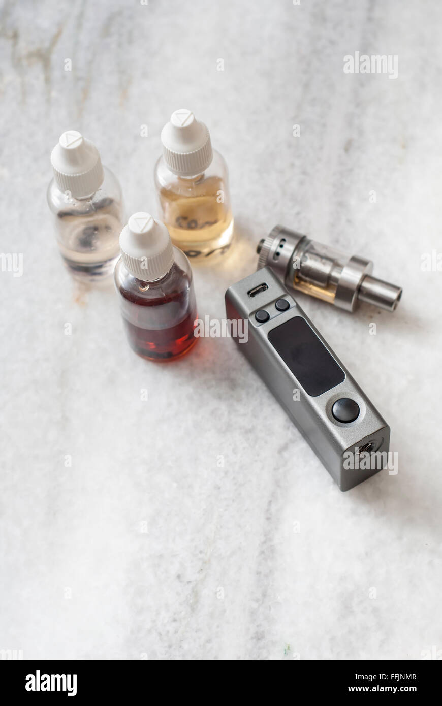 e-cigarettes with lots of different re-fill bottles, from above Stock Photo