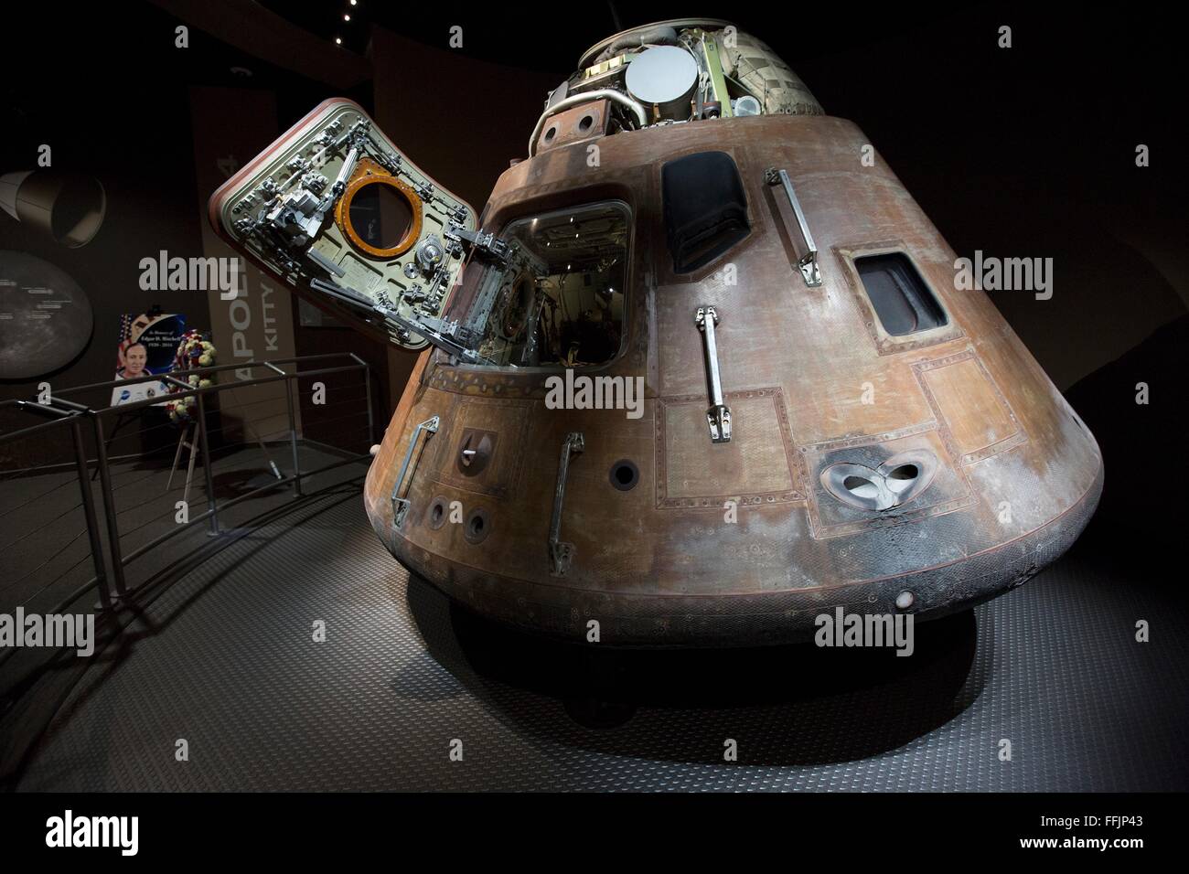 A memorial wreath placed next to the Apollo 14 command module exhibit at the Saturn V Building to honor the memory of former NASA astronaut Edgar Mitchell at the Kennedy Space Center February 12, 2016 in Cape Canaveral, Florida. Mitchell, one of 12 humans to walk on the moon died February 4, 2016. Stock Photo