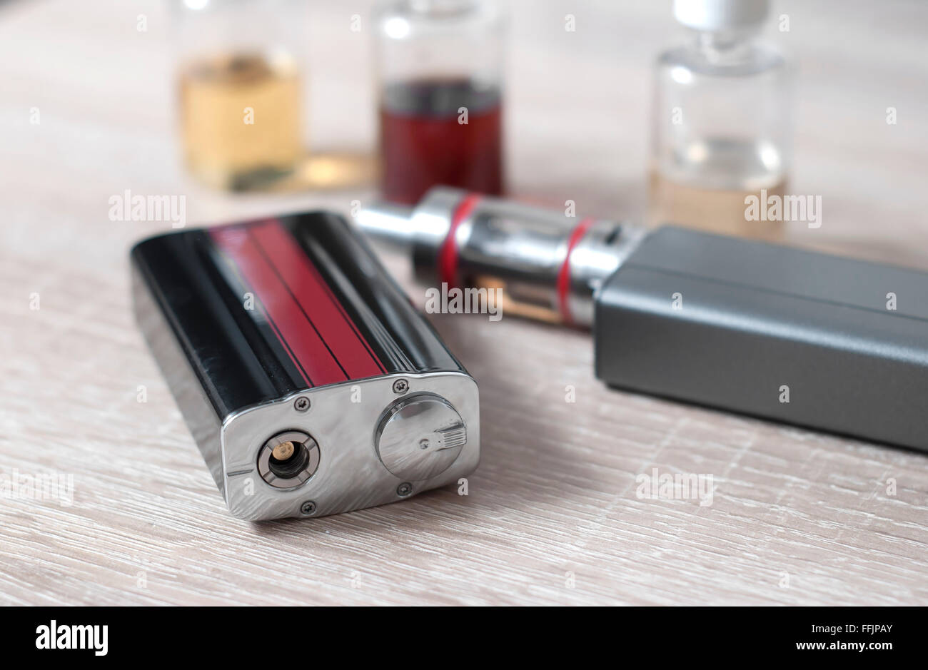 e-cigarettes with lots of different re-fill bottles, close up Stock Photo
