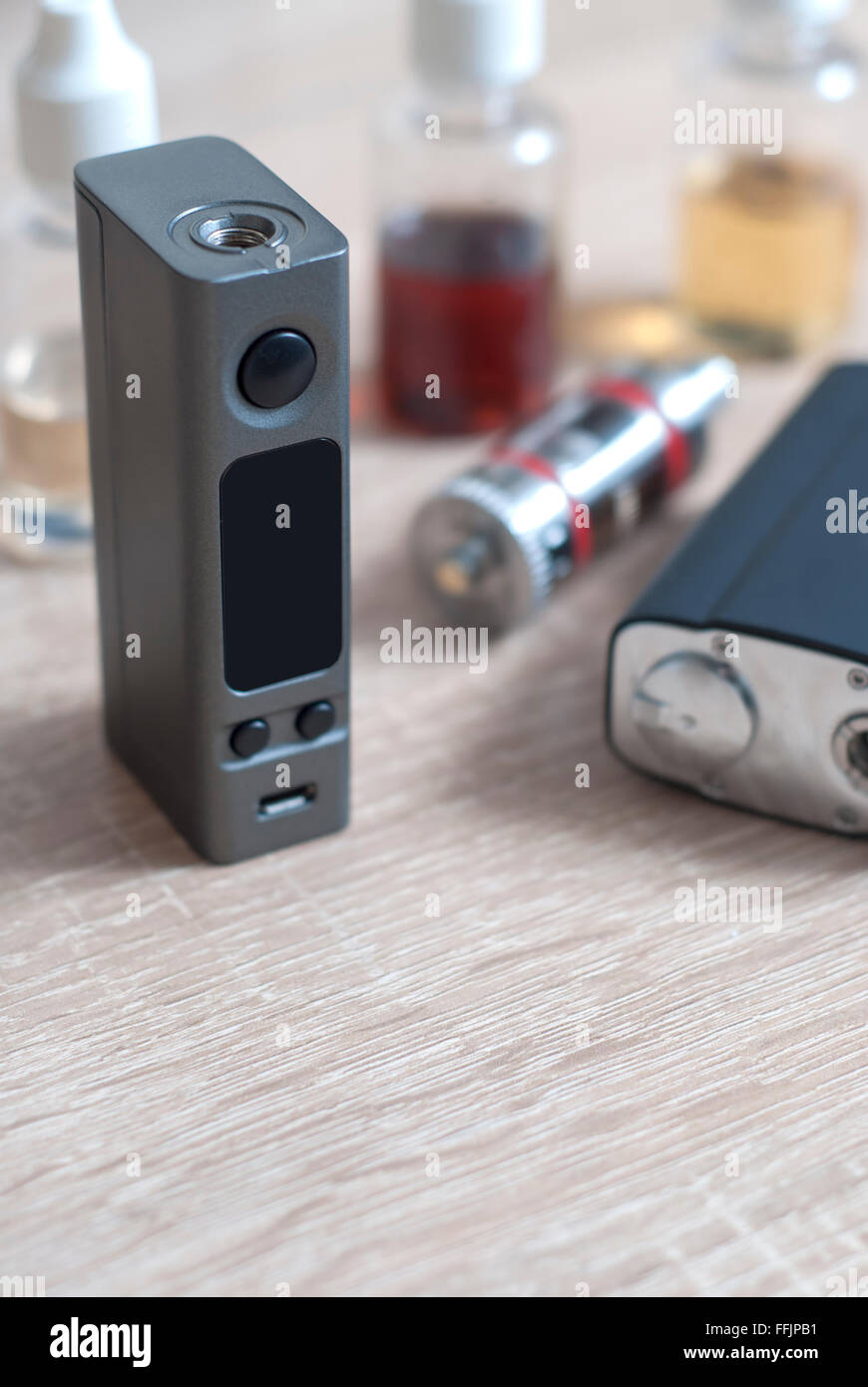 e-cigarettes with lots of different re-fill bottles, close up Stock Photo
