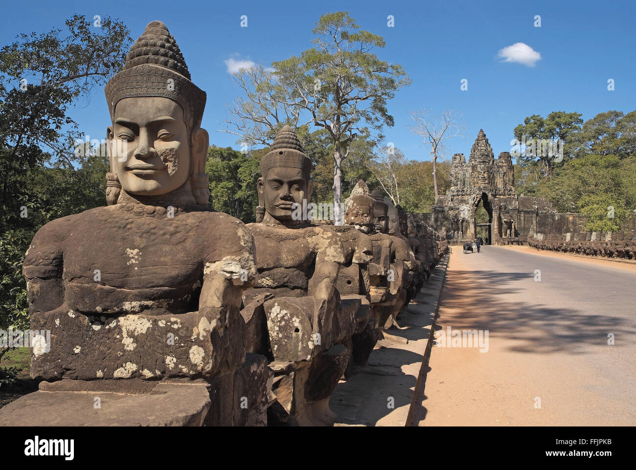 Devas (gods) statues on the parapet of the main bridge into Angkor Thom ...