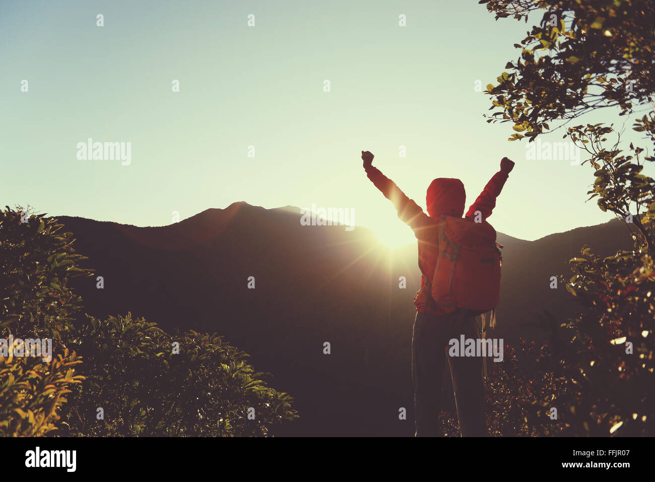 successful woman hiker open arms on sunrise mountain peak Stock Photo ...