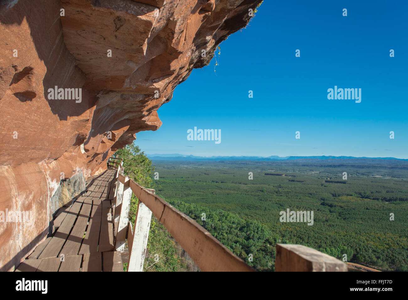 Phu Thok in Thailand. Wooden ladder on the side of the rocky mountains. Stock Photo
