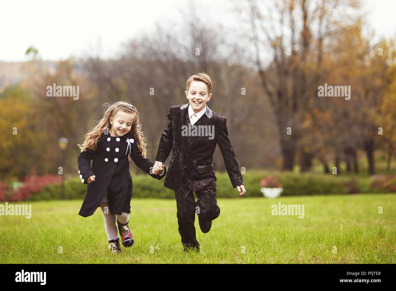 Brother and sister kids running Stock Photo