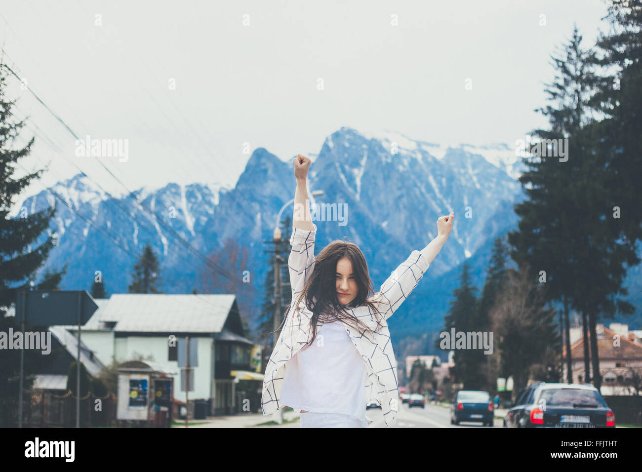 Hipster girl on mountain background Stock Photo