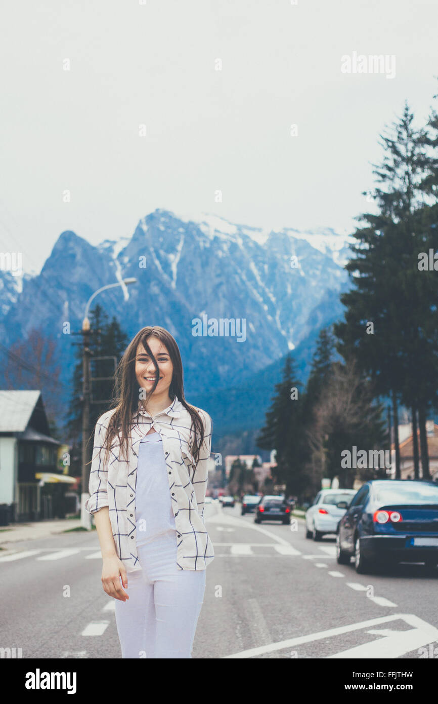 Hipster girl on mountain background Stock Photo