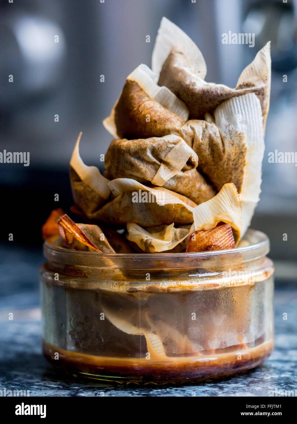 A heap of used tea bags, ready for home composting, in a real kitchen