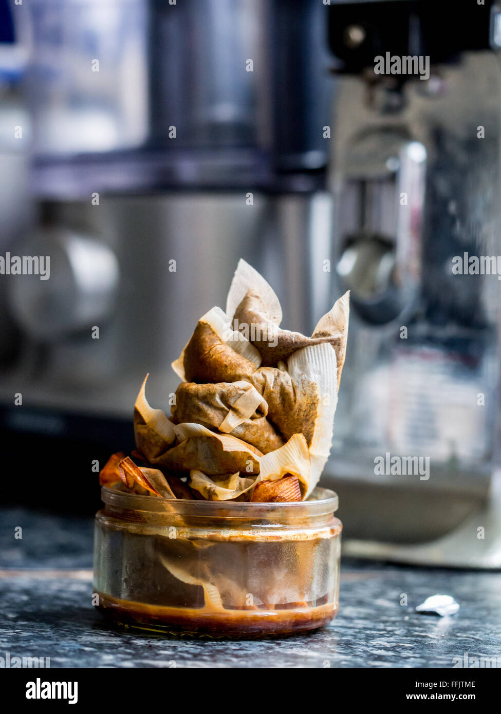 A heap of used tea bags, ready for home composting, in a real kitchen