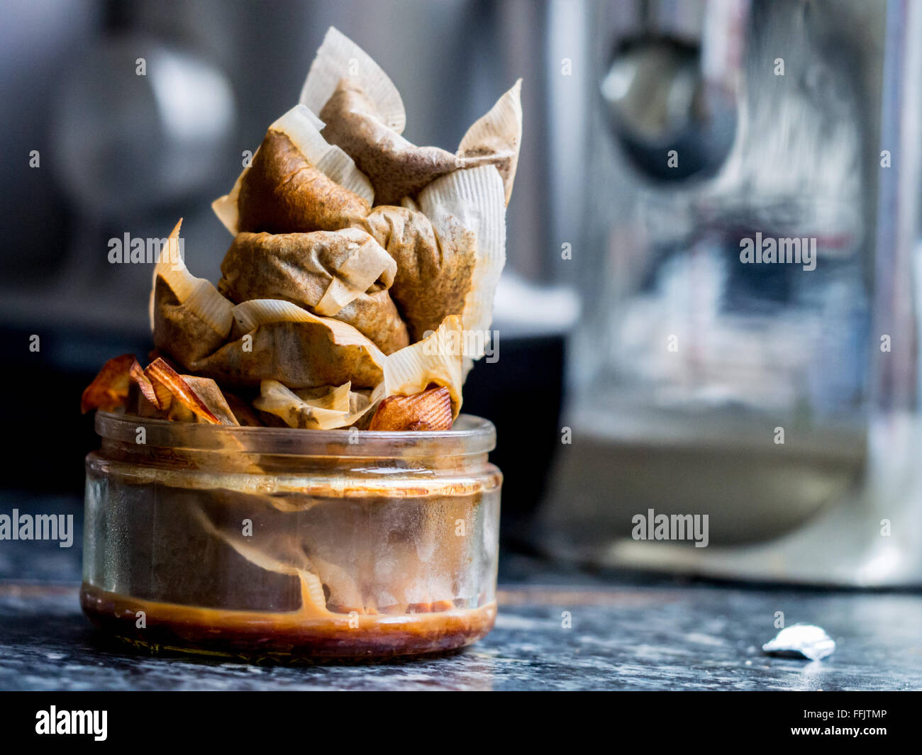 A heap of used tea bags, ready for home composting, in a real kitchen