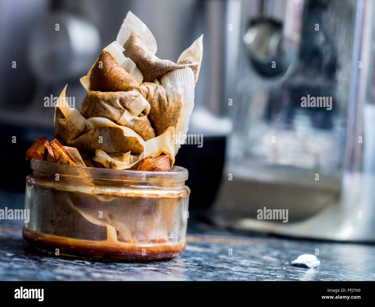 A heap of used tea bags, ready for home composting, in a real kitchen