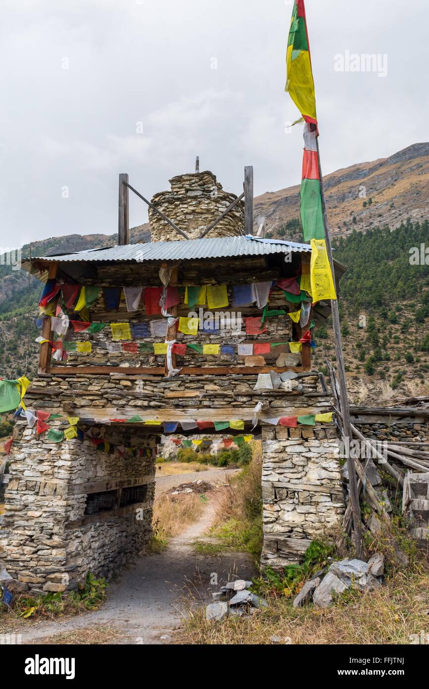 Colorful ornate buddhist stupa. Traditional village entrance in Nepal ...