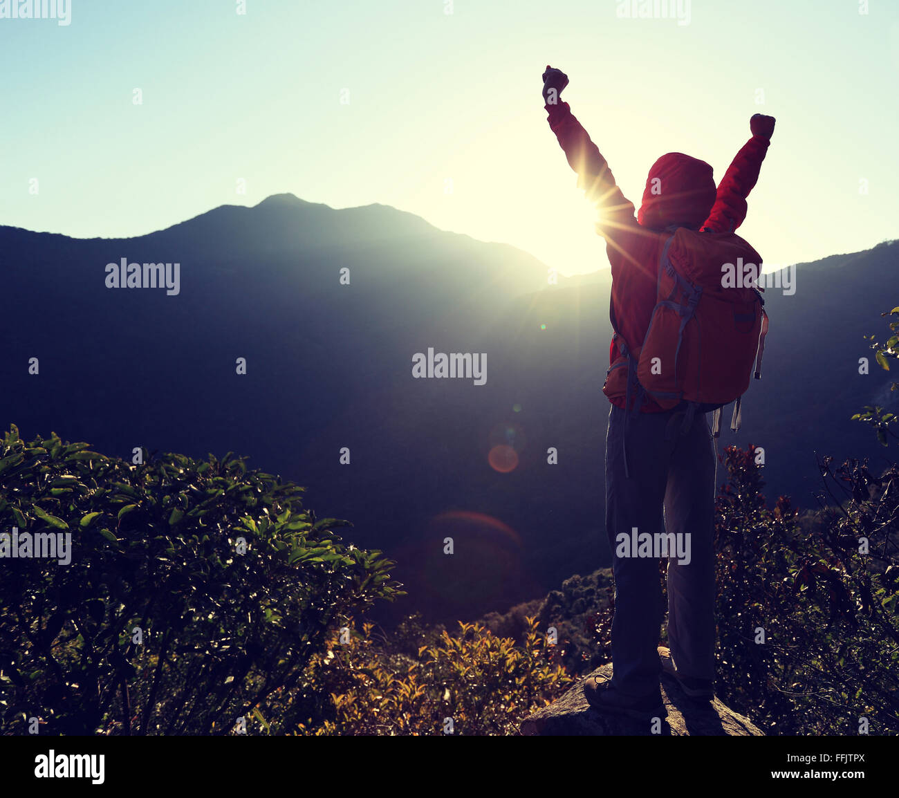 successful woman hiker open arms on sunrise mountain peak Stock Photo ...
