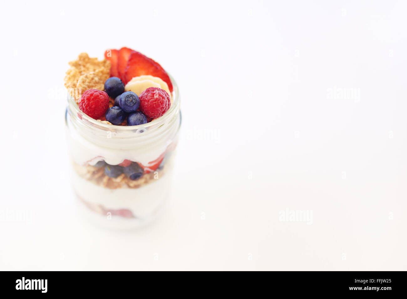 Yogurt, berries and cereal breakfast Stock Photo